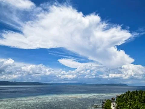 Expansive Tropical Ocean View with Dramatic Clouds and Distant Islands Stock Photos
