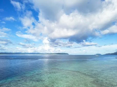 Expansive Tropical Ocean View with Dramatic Clouds and Distant Islands Stock Photos