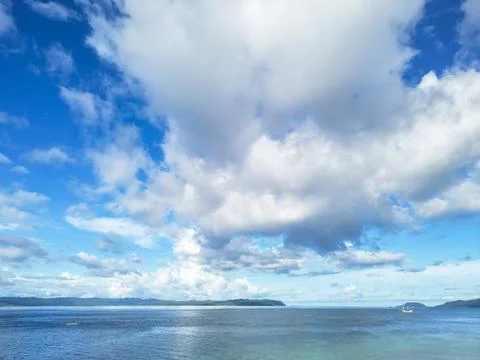 Expansive Tropical Ocean View with Dramatic Clouds and Distant Islands Stock Photos