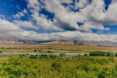 Expansive Valley Landscape Under Dramatic Cloudy Sky 스톡 사진