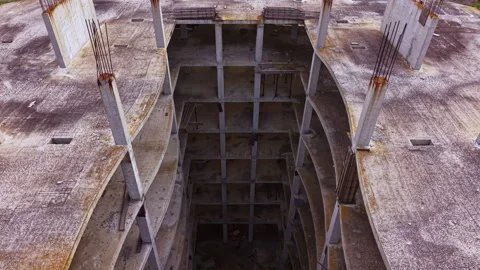 Expansive view of an abandoned construction site revealing the deep concrete Stock Footage 332096137