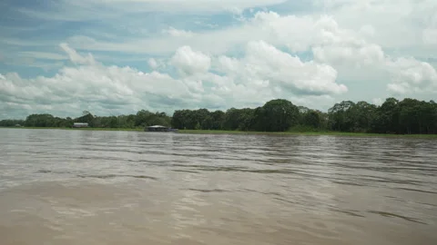 Expansive View of the Amazon River Under Partly Cloudy Skies Stock Footage 334137901