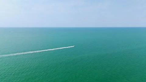 Expansive view of ocean at Naples, Florida. Calm waters under clear sky create Stock Footage 273832167