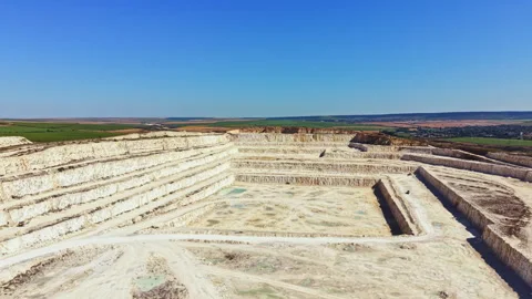 Expansive view of a quarry with several levels and clear sky Stock Footage 341611898