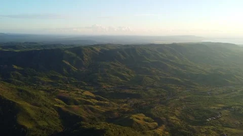 Expansive view of rolling hills and lush greenery stretching to the horizon, Stock Footage 316925066