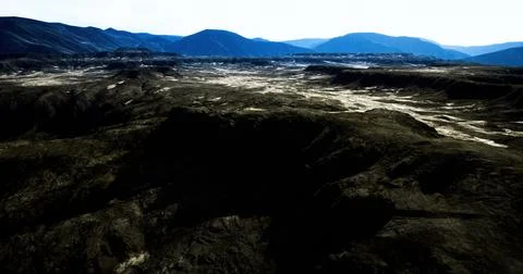 Expansive view of rugged terrain under bright clear sky in remote area Stock Illustration