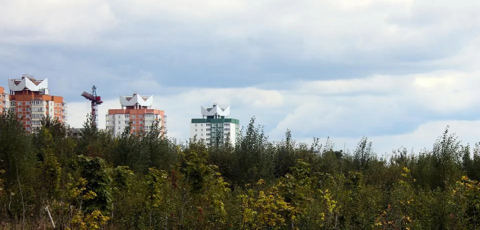 An Expansive View of Urban Development Set Against a Lush Natural Landscape.. Stock Photos