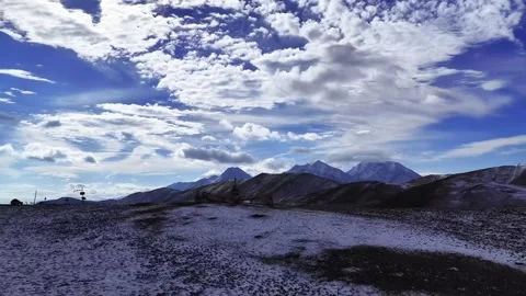 Expansive Winter Mountain Landscape With Snow and Clouds Qilian Mountains China Video stock 339269800