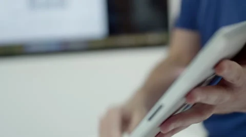 Expat businessman using digital tablet at office. Stock Footage 64102391