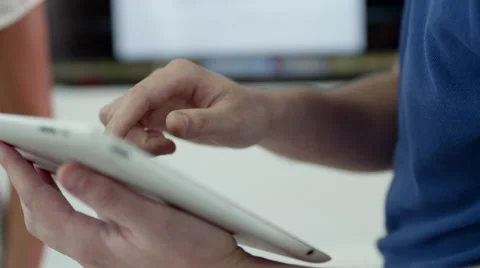 Expat businessman using digital tablet at office. Stock Footage 64102740