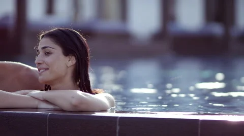 Expat couple at poolside. Stock Footage 64112760