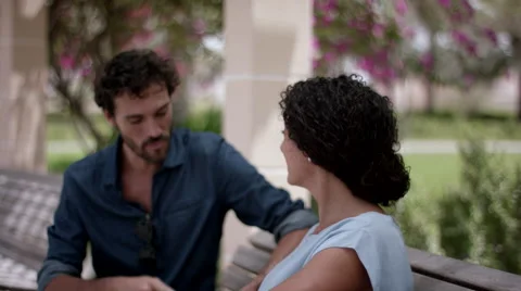 Expat couple using digital tablet at park. Stock Footage 63508971