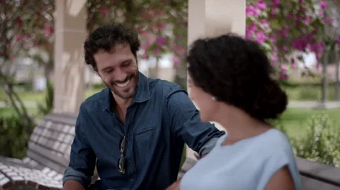 Expat couple using digital tablet at park. Stock Footage 63509141