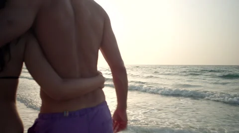 Expat couple walking at beach. Stock Footage 64111613