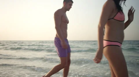 Expat couple walking at beach. Stock Footage 64112275