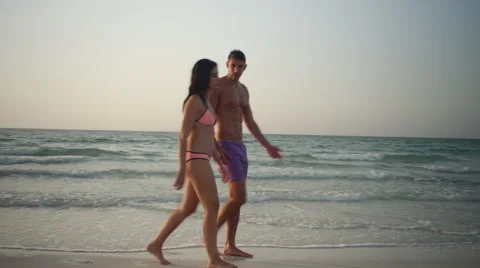 Expat couple walking at beach. Stock Footage 64112523