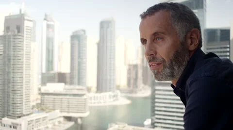 Expat man drinking coffee at balcony. Stock Footage 64119609