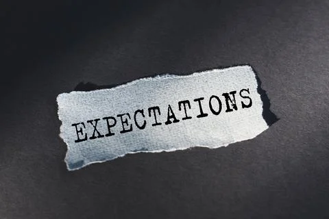 Expectations word written on torn paper. Close up Stock Photos