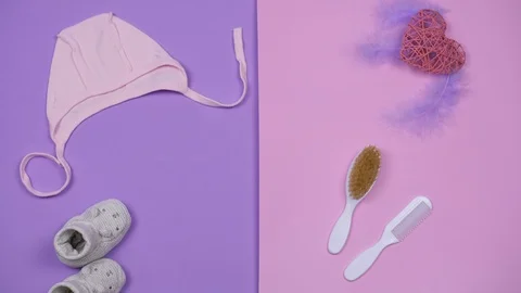 Expecting baby concept. Stop motion animation of booties and other things for Stock Footage 129151009