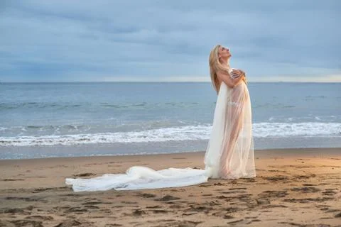 Expecting mother looking up into the sky. Stock Photos