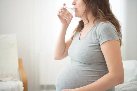 Expecting mother maintaining hydration 스톡 사진