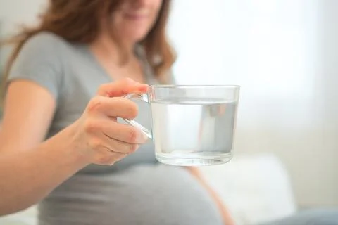 Expecting mother maintaining hydration Stock Photos