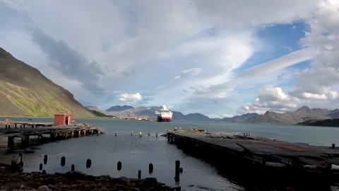Expedition ship in Grytviken harbor with dramatic sky, South Georgia, 4K Vídeos de archivo 332357336