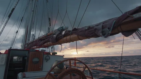 Expeditional sailing vessel moves in the Atlantic Ocean during sunrise Stock Footage 341667018