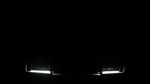 Expeditionary SUV switch on bright headlight and additional illumination. Stock Footage 75951490