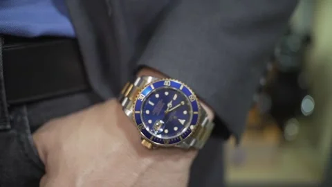 Expensive and luxury rolex watch in a billionaire man's hands Stock Footage