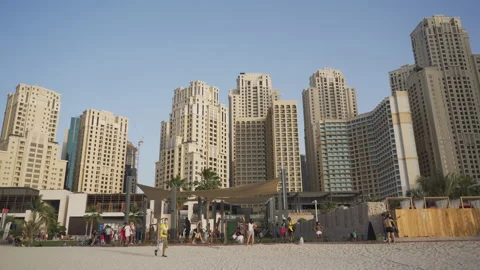 Expensive and tall buildings in the same style near the beach. Video stock 151952832