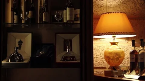 Expensive drinks shelve besides a lamp Stock Footage 62152687