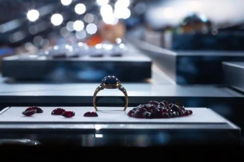 An expensive gemstone wedding ring is seen close up inside a jewelry store. R 스톡 사진