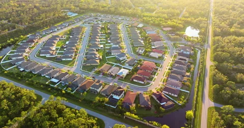 Expensive mansions between green palm trees in southwest Florida suburbs, USA Stock Footage 334737651
