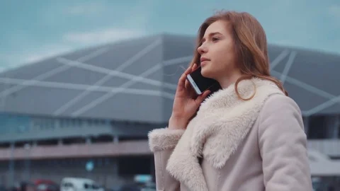 Expensive modern car picks up young perspective business woman from office Stock Footage 73590621