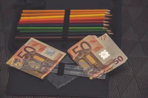 Expensive school theme, pencil case with euro money Stock Photos