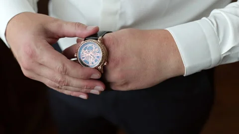 Expensive watch on his hand. Stock Footage 167606209