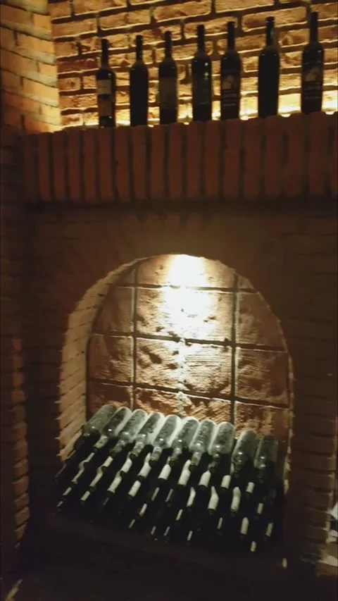 Expensive wine bottles on the wine rack. Vertical video. Vidéo 224930369