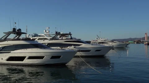 Expensive yachts at pier in front of building of Marine Station. Sochi seaport. Stock Footage 145273420