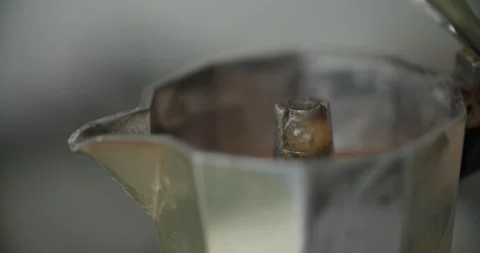 Experience the art of authentic espresso brewing using a classic Moka pot method Stock Footage 297373938
