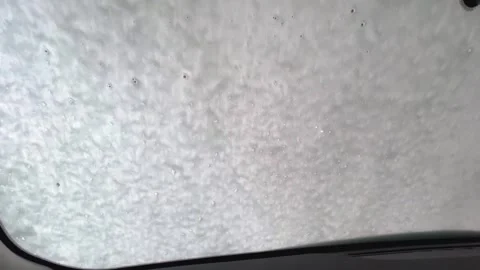 Experience of an automatic car wash with a robot in action, showcasing powerful Stock Footage 317021346