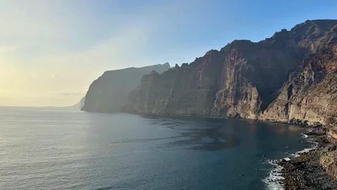 Experience the breathtaking coastal cliffs alongside serene ocean views that Stock Photos