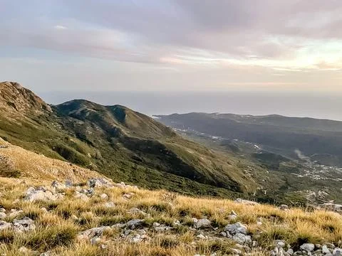 Experience a breathtaking mountain view that uniquely overlooks the ocean during Stock Photos