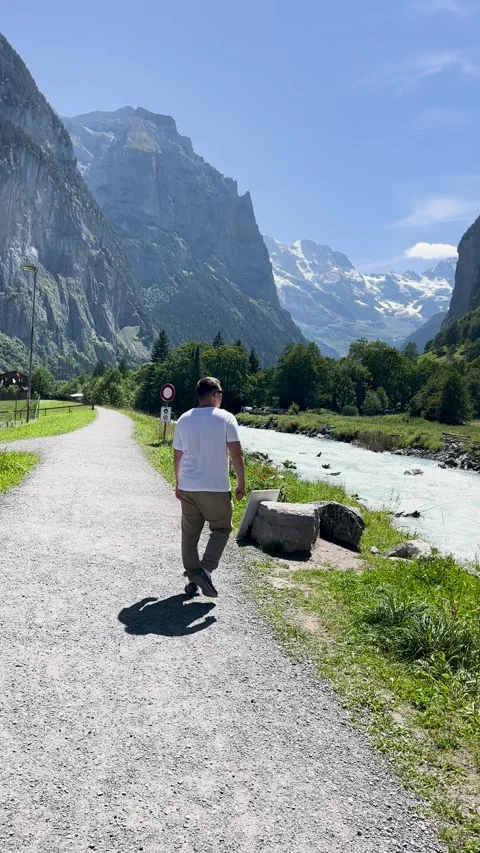 Experience a breathtaking scenic pathway set in a serene, picturesque mountain Stock Footage 304780428