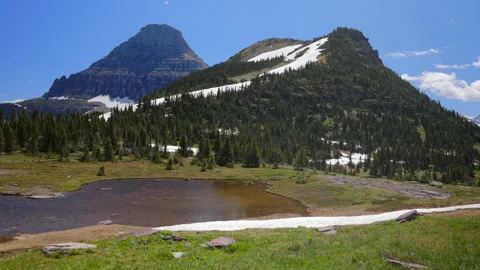 Experience the breathtaking scenic views found in Glacier National Park located Stock Footage 313563670