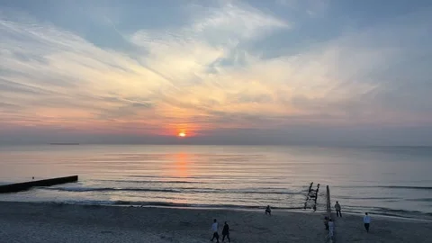 Experience a breathtaking sunset casting vibrant colors over a serene and Video stock 304730078