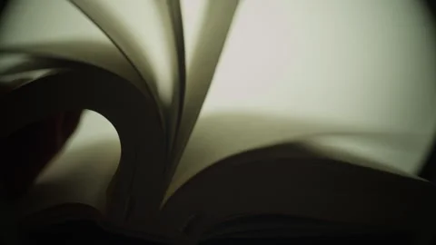 Experience the calming sound of flipping Bible pages in a quiet setting Stock Footage 320045609