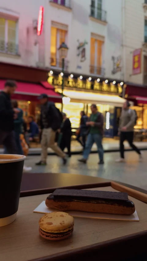 Experience a charming street scene filled with delicious pastries and aromatic Stock Footage 318553651