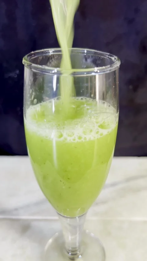Experience the crisp and refreshing taste of a cucumber drink Stock Footage 287810876