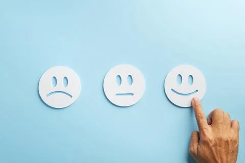Experience customer feedback, hand selecting happy face emoji showcasing po.. Foto stock